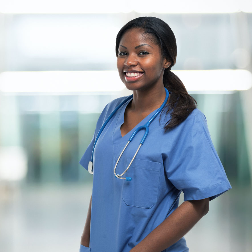 Headshot of black nurse in blue scrubs 